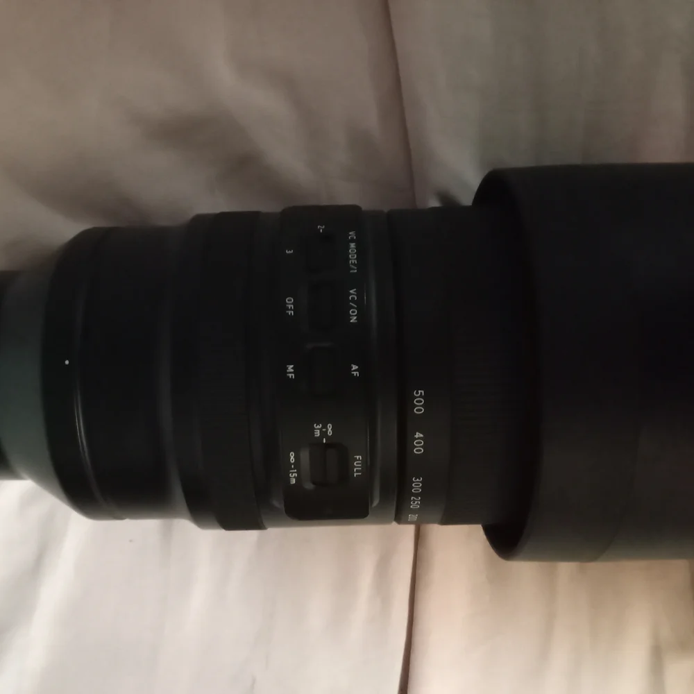 Black Telephoto Zoom Lens with Textured Focusing Ring and Robust Construction